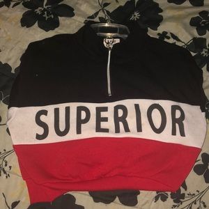 Red, white, and black half-zip sweater